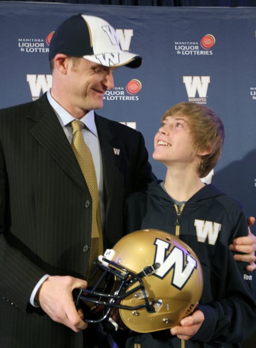 Winnipeg Blue Bombers new head coach Mike O'Shea is introduced with his 13 year old son Mike  at a news conference at the Fairmont Hotel in downtown Winnipeg Wednesday afternoon-   See Gary Lawless and Melissa Martin  stories- Dec 04, 2013   (JOE BRYKSA / WINNIPEG FREE PRESS)