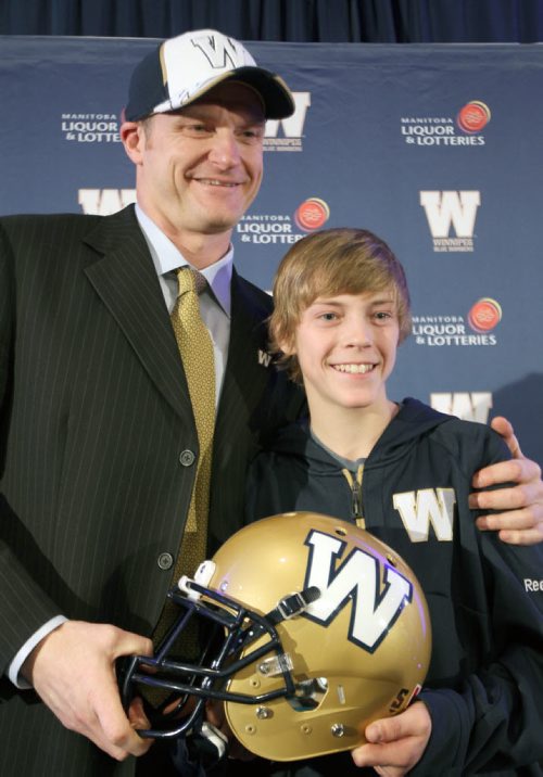 Winnipeg Blue Bombers new head coach Mike O'Shea is introduced with his 13 year old son Mike at a news conference at the Fairmont Hotel in downtown Winnipeg Wednesday afternoon-   See Gary Lawless and Melissa Martin  stories- Dec 04, 2013   (JOE BRYKSA / WINNIPEG FREE PRESS)