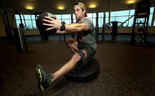 Tim Shantz at the Wellness Centre demonstrates poses that require "concentration" see his tale. December 4, 2013 - (Phil Hossack / Winnipeg Free Press)