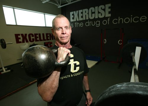 Coach Cole Summers in the weight room of Garden City Collegiate, the weight training coach , an icon in teaching kids and exercise novices in how to properly and safely train with weights. Asheey Prest story. December 4, 2013 - (Phil Hossack / Winnipeg Free Press)