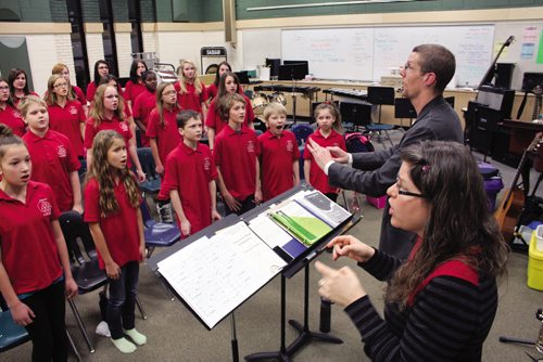 Canstar Community News James and Judy Thevenot conduct during choir rehearsal at Miles MacDonell Collegiate. (JORDAN THOMPSON)