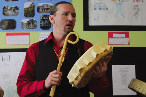 Canstar Community News Todd DeChateauvert plays a traditional Aboriginal song at the Inner City Youth Alive art show. (JORDAN THOMPSON)