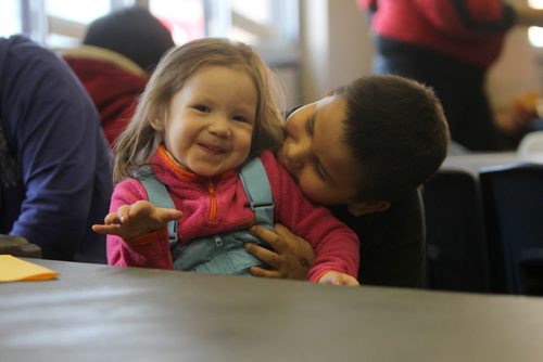 Six year old Frank Bouchie plays with his little sister Bliss -2 years at the annual Salvation Army Christmas breakfast Saturday morning.  Dec 7, 2013 Ruth Bonneville / Winnipeg Free Press