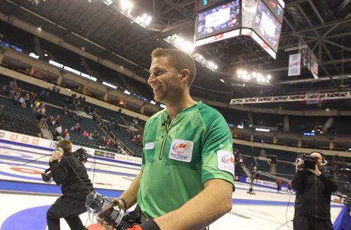 Morris celebrates his teams win in the semi final game   at  MTS Centre Thursday  for TIm Hortons Roar of the Rings Canadian Curling Trials .  Dec 07, 2013Ruth Bonneville / Winnipeg Free Press