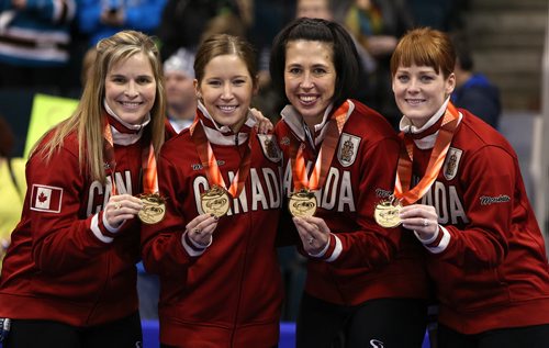 From left, skip Jennifer Jones and her team, Kaitlyn Lawes, Jill Officer and Dawn McEwen celebrate after defeating Sherry Middaugh in the womenÄôs final of Roar of the Rings curling at the MTS Centre on Sat., Dec. 7, 2013 to win the right to represent Canada at the Winter Olympics in Sochi, Russia, in February. Photo by Jason Halstead/Winnipeg Free Press