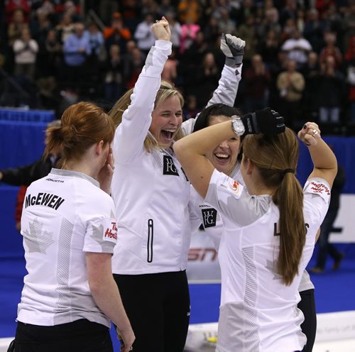 Skip Jennifer Jones and her team, Dawn McEwen, Jill Officer and Kaitlyn Lawes celebrate after defeating Sherry Middaugh in the womenÄôs final of Roar of the Rings curling at the MTS Centre on Sat., Dec. 7, 2013 to win the right to represent Canada at the Winter Olympics in Sochi, Russia, in February. Photo by Jason Halstead/Winnipeg Free Press