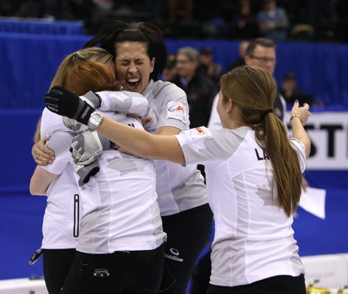 Skip Jennifer Jones and her team, Dawn McEwen, Jill Officer and Kaitlyn Lawes celebrate after defeating Sherry Middaugh in the womenÄôs final of Roar of the Rings curling at the MTS Centre on Sat., Dec. 7, 2013 to win the right to represent Canada at the Winter Olympics in Sochi, Russia, in February. Photo by Jason Halstead/Winnipeg Free Press