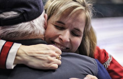 Jennifer Jones hugs her father, Larry Jones, after winning the Canadian Curling Trials to become an Olympian for the 2014 Olympic Games in Sochi, Russia.   131206 December 6, 2013 Mike Deal / Winnipeg Free Press