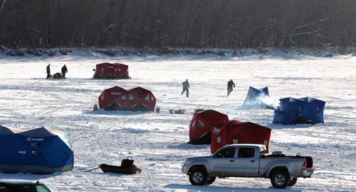 Ice fishing shacks have sprung up on the Red River just north of Selkirk, MB, Sunday morning.  131208 December 8, 2013 Mike Deal / Winnipeg Free Press
