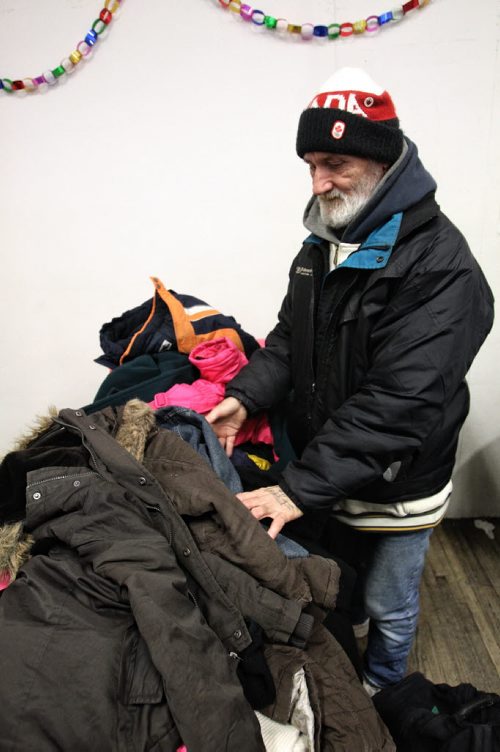 Tom Goulet at the Lighthouse Mission hoping to find a few bits of clothing to help keep him warm as the temperatures drop into the -20C's. Lighthouse Mission hosted the Clothe the City event today, it started in 2006 to give the gift of warmth by providing clothing to those in need during the Winnipeg winter season. 131208 - December 8, 2013 MIKE DEAL / WINNIPEG FREE PRESS