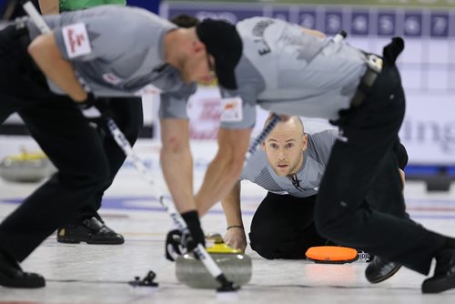 Third Ryan Fry of Brad Jacobs's team shoots during action against John MorrisÄôs team in the menÄôs final of Roar of the Rings curling at the MTS Centre on Sun., Dec. 8, 2013. Photo by Jason Halstead/Winnipeg Free Press