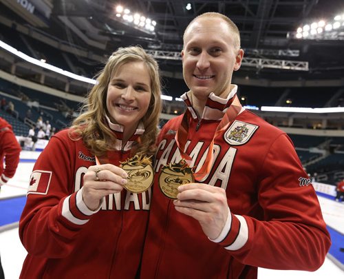 Skips Brad Jacobs and Jennifer Jones show off their medals and Team Canada Garb after the Roar of the Rings curling at the MTS Centre on Sun., Dec. 8, 2013. Jones and Jacobs won the right to represent Canada at the Winter Olympics in Sochi, Russia, in February. Photo by Jason Halstead/Winnipeg Free Press