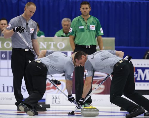 Skip Brad Jacobs (left) watches a shot during action against John MorrisÄôs team in the menÄôs final of Roar of the Rings curling at the MTS Centre on Sun., Dec. 8, 2013. Photo by Jason Halstead/Winnipeg Free Press