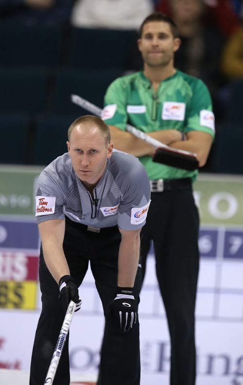 Skip Brad Jacobs (front) watches a shot during action against John MorrisÄôs team in the menÄôs final of Roar of the Rings curling at the MTS Centre on Sun., Dec. 8, 2013. Photo by Jason Halstead/Winnipeg Free Press