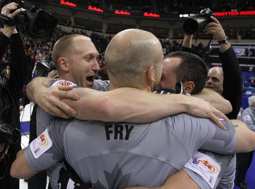 Skip Brad Jacobs and teammates celebrate after defeating John MorrisÄôs team in the menÄôs final of Roar of the Rings curling at the MTS Centre on Sun., Dec. 8, 2013. Jacobs won the right to represent Canada at the Winter Olympics in Sochi, Russia, in February. Photo by Jason Halstead/Winnipeg Free Press
