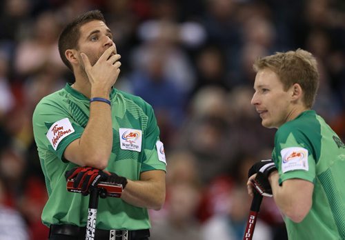 Skip John Morris (left) reacts to a shot during action against Brad JacobsÄôs team in the menÄôs final of Roar of the Rings curling at the MTS Centre on Sun., Dec. 8, 2013. Jacobs defeated Morris and won the right to represent Canada at the Winter Olympics in Sochi. Photo by Jason Halstead/Winnipeg Free Press