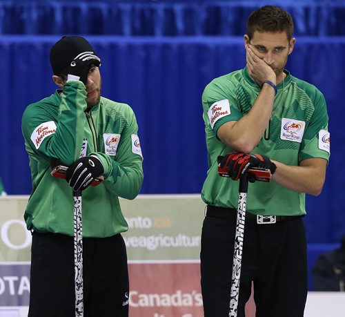 Skip John Morris (right) and Jim Cotter react to a shot during action against Brad JacobsÄôs team in the menÄôs final of Roar of the Rings curling at the MTS Centre on Sun., Dec. 8, 2013. Jacobs defeated Morris and won the right to represent Canada at the Winter Olympics in Sochi. Photo by Jason Halstead/Winnipeg Free Press