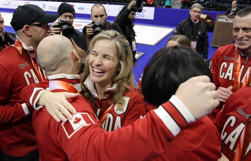 Skip Jennifer Jones celebrates with Brad Jacobs and his teammates after they defeated John MorrisÄôs team in the menÄôs final of Roar of the Rings curling at the MTS Centre on Sun., Dec. 8, 2013. Jacobs won the right to represent Canada at the Winter Olympics in Sochi, Russia, in February. Photo by Jason Halstead/Winnipeg Free Press