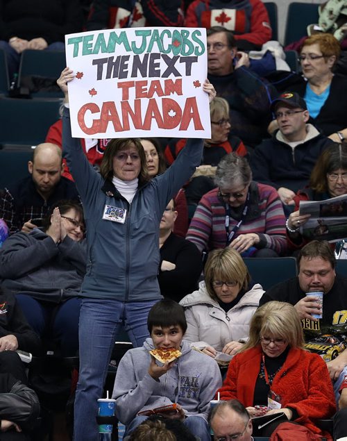 A fan holds up a sign cheering on skip Brad Jacobs against John MorrisÄôs team in the menÄôs final of Roar of the Rings curling at the MTS Centre on Sun., Dec. 8, 2013. Jacobs won the right to represent Canada at the Winter Olympics in Sochi, Russia, in February. Photo by Jason Halstead/Winnipeg Free Press