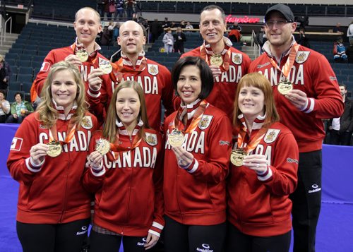 Skip Brad Jacobs team and skip Jennifer Jones and her team show off their medals and Team Canada garb after the Roar of the Rings curling at the MTS Centre on Sun., Dec. 8, 2013. The two teams won the right to represent Canada at the Winter Olympics in Sochi, Russia, in February. Photo by Jason Halstead/Winnipeg Free Press