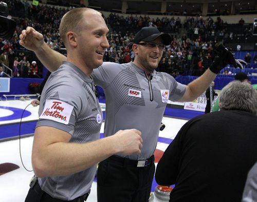 Skip Brad Jacobs and teammates celebrate after defeating John MorrisÄôs team in the menÄôs final of Roar of the Rings curling at the MTS Centre on Sun., Dec. 8, 2013. Jacobs won the right to represent Canada at the Winter Olympics in Sochi, Russia, in February. Photo by Jason Halstead/Winnipeg Free Press
