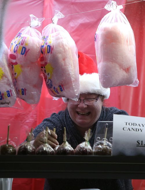 Tracy MacDonald prepares treats for visitors at Mitchell's Concessions at the Canad Inns Winter Wonderland drive-through holiday light park at Red River Exhibition Park on Sun., Dec. 8, 2013. Photo by Jason Halstead/Winnipeg Free Press