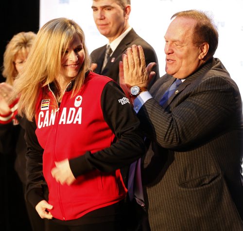 Marcel Aubut claps after giving Jennifer Jones her Olympic team jacket , The Canadian Olympic Committee nominated Canada's winning curling teams , Jennifer Jones  and Brad Jacobs  team  to the Sochi Olympics , By COC President Marcel Aubut - Dec. 9 2013 / KEN GIGLIOTTI / WINNIPEG FREE PRESS