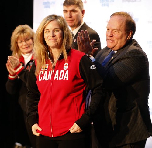 Marcel Aubut claps after giving Jennifer Jones her Olympic team jacket . The Canadian Olympic Committee nominated Canada's winning curling teams , Jennifer Jones  and Brad Jacobs  team  to the Sochi Olympics , By COC President Marcel Aubut - Dec. 9 2013 / KEN GIGLIOTTI / WINNIPEG FREE PRESS