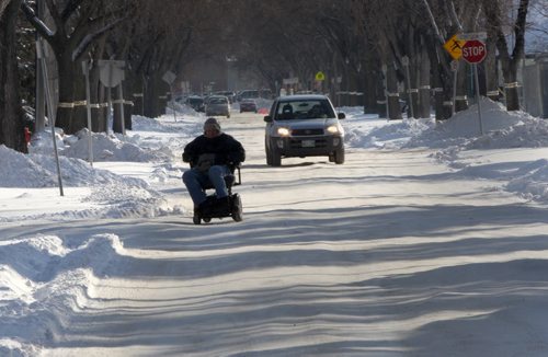 Ruts on residential streets that have not been plowed after recent snow storm have made driving difficult  for cars not to metion the handicaped as seen on Rockwood St in Winnipeg-See story- Dec 09, 2013   (JOE BRYKSA / WINNIPEG FREE PRESS)