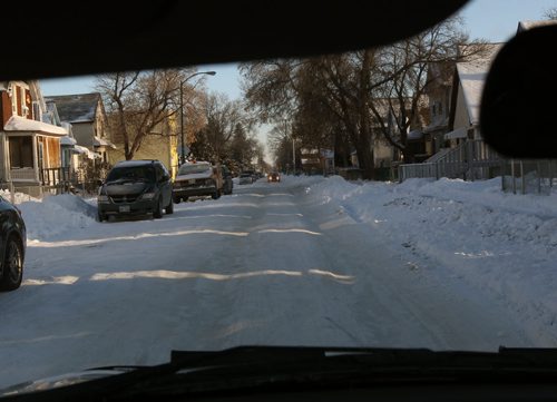 Ruts on streets such as this one at Ross Ave West in Winnipeg Monday-See story- Dec 09, 2013   (JOE BRYKSA / WINNIPEG FREE PRESS)