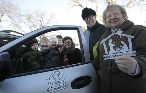 Faith Page. Members of St. Gerard Parish from right, Betty Bahr with magnet, husband Steve Bahr, Shirley Ward, Delores Matthews, Sylvia Goska and Andrea Helgason with grandson Carson.   Brenda Suderman story about a  local Catholic group that sells car magnets "Keep Christ in Christmas   Wayne Glowacki / Winnipeg Free Press Dec.9 2013
