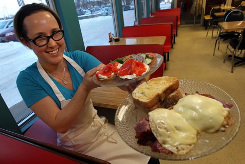 Beth Jacob, Chef at Bernstein's Deli poses with her Latka Stacker (Front) and Bagel with Cream Cheese and Lox. See Marion's story. December 9, 2013 - (Phil Hossack / Winnipeg Free Press)