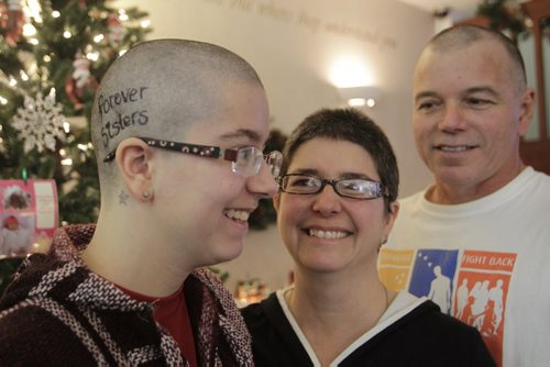 From left, Amy Foidart and her parents Claudette and Morris  Foidart got their hair cuts Tuesday morning and were dropping of money raised for Ronald McDonald House. Amy raised over $3,000 in honour of her sister Sarah who died from a brain tumour in 2003. She also made a bet with her parents that if she raised over $2,000 her parents would shave their heads as well.  Danielle Da Silva story  Wayne Glowacki / Winnipeg Free Press Dec.10 2013