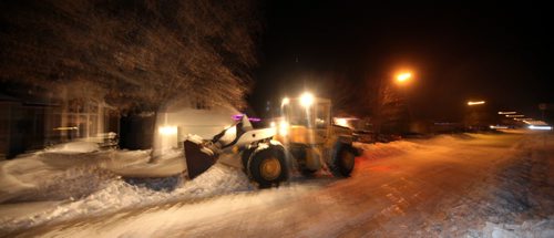 Plows clear residential driveways along Beecher ave in the city's NW Tuesday night. See story.  December 10, 2013 - (Phil Hossack / Winnipeg Free Press)