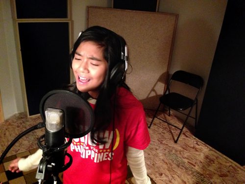 Local singer Maria Aragon in Private Ear Recording studio  performs  benefit song--United We Stand for typhoon relief in Philippines along with choir.  Separate shots taken during recording and group photo. See Kevin Prokosh story.    Dec 07, 2013 Ruth Bonneville / Winnipeg Free Press