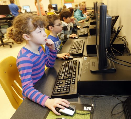 Kids Write Code for computers Äì students at Pacific Junction  School will take part in Hour of Code Project , they are learning to operate their computers  and not just use them Äì Gr. 2 student Kate Ewen   in school computer lab , Dec. 11 2013 / KEN GIGLIOTTI / WINNIPEG FREE PRESS