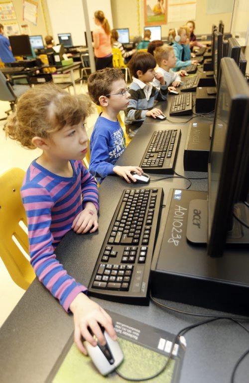 Kids Write Code for computers Äì students at Pacific Junction  School will take part in Hour of Code Project , they are learning to operate their computers  and not just use them Äì Gr. 2 student Kate Ewen   in school computer lab , Dec. 11 2013 / KEN GIGLIOTTI / WINNIPEG FREE PRESS