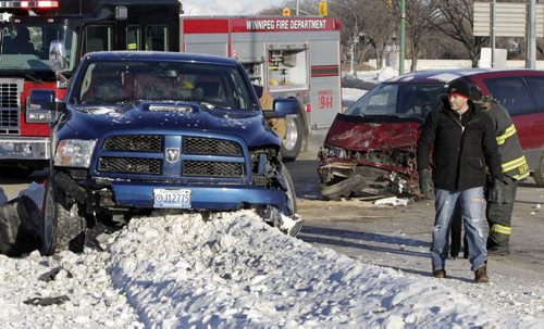 No one was injured in a two vehicle collision on Empress St. at John Blick Ave. that knocked out a traffic light standard tied up the intersection Wednesday morning.    Wayne Glowacki / Winnipeg Free Press Dec.11. 2013