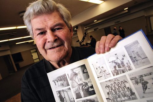 Dick Friesen former principle at Warren Collegiate holds a 1983 yearbook with photos of Cathy Holtmann playing basketball in Grade Twelve. Cathy will be entered into the Manitoba Sport Hall of Fame in May of 2014 for her efforts as a basketball player and coach. 131211 - December11, 2013 MIKE DEAL / WINNIPEG FREE PRESS