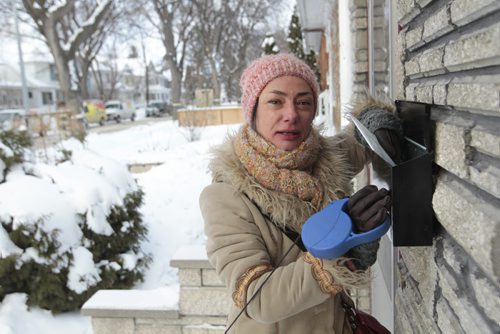 Streeter on Canada Post plans to end urban delivery over the next 5 years. Comments from Victoria Stone in the Wolseley area at her mailbox. Roberta Bell story. Wayne Glowacki / Winnipeg Free Press Dec.11. 2013
