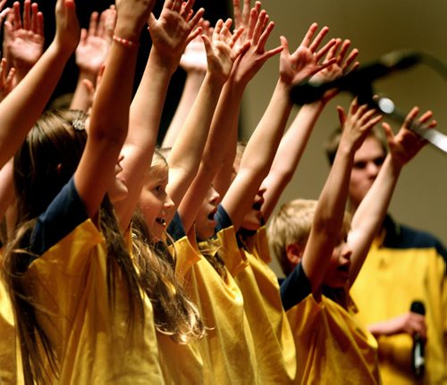 Members of the Winnipeg Youth Chorus lift their arms in celebration Wednesday evening at a Holiday Concert and "Mini-Folklorama" in Westminister United Church. See release, This was put on by the Manitoba Schizophrenia Society. December 11, 2013 - (Phil Hossack / Winnipeg Free Press)
