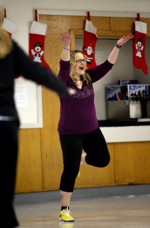 Jill Graham, a Winnipeg lab technician who lost more than 100 pounds leads a Zumba class at a St James Community Center Thursday. Her impetus was a local chapter of TOPS, a not-for-profit weight loss group based in the United States. December 2, 2013 - (Phil Hossack / Winnipeg Free Press)