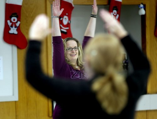 Jill Graham, a Winnipeg lab technician who lost more than 100 pounds leads a Zumba class at a St James Community Center Thursday. Her impetus was a local chapter of TOPS, a not-for-profit weight loss group based in the United States. December 2, 2013 - (Phil Hossack / Winnipeg Free Press)