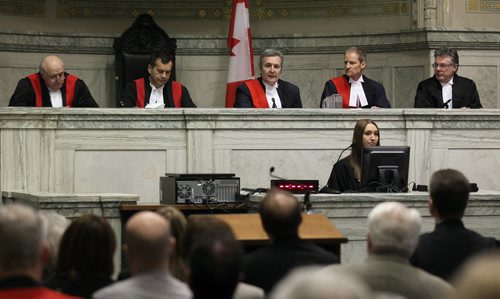 Left to right, Hon. Assoc.Chief Judge John P. Guy, Hon Ken Champagne Chief Judge of the Provincial Court of Manitoba, Hon. Chief Judge Court of Queens Bench, Hon Glenn Joyal, Chief Justice of the Court of Queen's Bench, Hon. Justice James G. Edmond and Hon Richard Chartier Chief Justice of Manitoba (Court of Appeal), Preside at the swearing in ceremony of Justices Edmond and Guy Friday at the downtown court house. See story. December 13, 2013 - (Phil Hossack / Winnipeg Free Press)