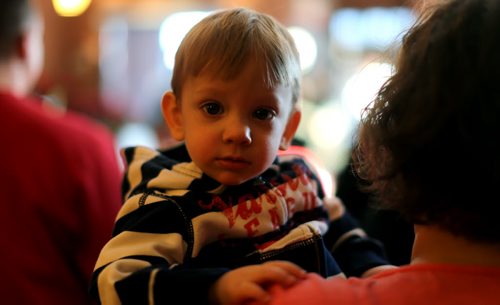 Liam Norosky, 15mo, inside Thea's Diner in Morris, Manitoba. Milt Stegall flew up from Atlanta to show support for Thea Morris in the small community, Saturday, December 14, 2013. (TREVOR HAGAN/WINNIPEG FREE PRESS)