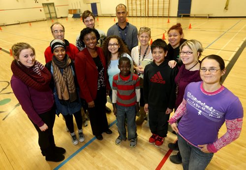 Teachers and members from the Boys and Girls Club who are volunteering to assist in a nationwide study linking fitness and literacy organized by Start2Finish at Sister MacNamara Elementary School, Friday, December 13, 2013. (TREVOR HAGAN/WINNIPEG FREE PRESS)