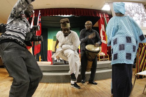 December 15, 2013 - 131215  -  Deji Salami (c) and others dance with KB Fujumelody at an event celebrating the life of Nelson Mandela at the Ethiopian Cultural Centre Sunday, December 15, 2013. John Woods / Winnipeg Free Press