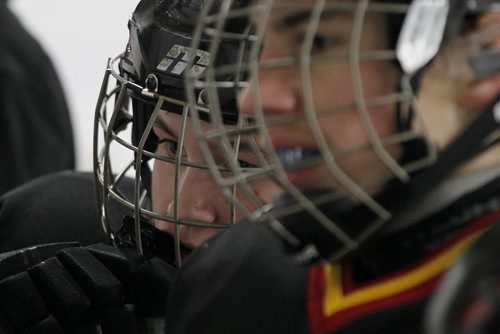 December 15, 2013 - 131215  -  Drew Angers (8) of the 12A1 Fort Garry North Flyers talks to his coach between shifts as they play the 12A1 Dakota Lazers at St Vital Arena Sunday, December 15, 2013. John Woods / Winnipeg Free Press