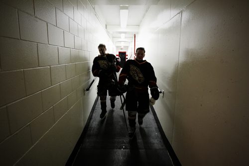 December 15, 2013 - 131215  -  Josh gardiner (10) and Drew Angers (8) of the 12A1 Fort Garry North Flyers walk to the dressing room after defeating the 12A1 Dakota Lazers at St Vital Arena Sunday, December 15, 2013. John Woods / Winnipeg Free Press