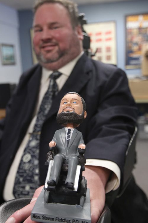 Steven Fletcher's Christmas calendar is full of photos of Winnipeg with his bobblehead in them. His bobbleheads have become well sought afterBiz see story - Dec 16, 2013   (JOE BRYKSA / WINNIPEG FREE PRESS)